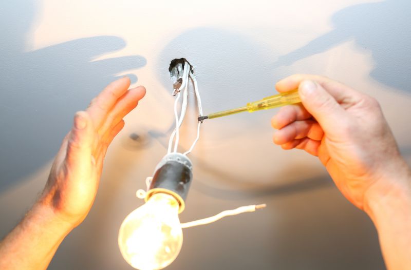 Handyman Installing a Light Fixture